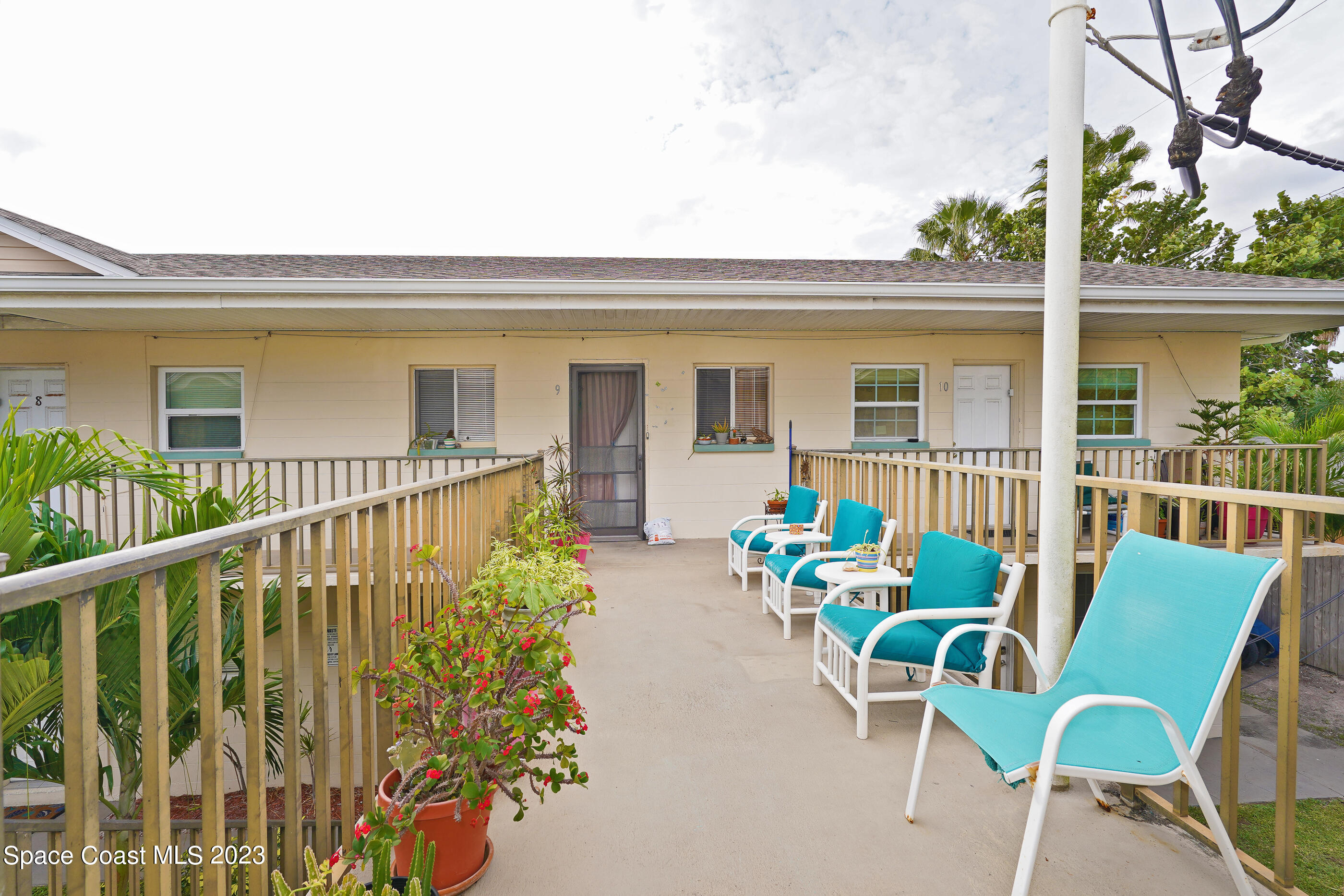 404 Tyler Avenue, Unit 14 Cape Canaveral, FL 32920 - Photo 23 of 29 a view of a chair and table in the balcony
