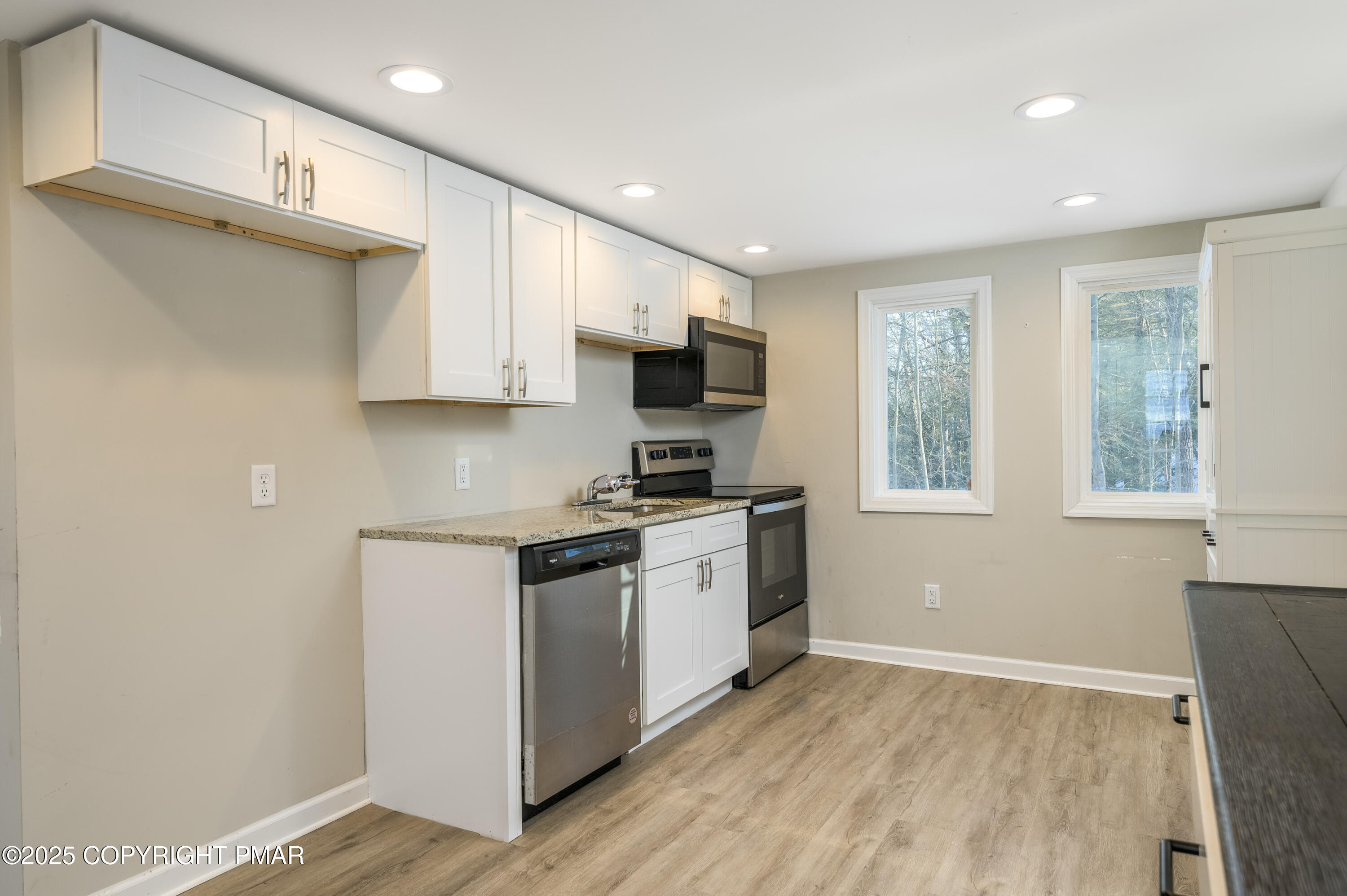 6151 Kansa Road East Stroudsburg, PA 18302 - Photo 12 of 26 a kitchen with a stove a sink and a microwave