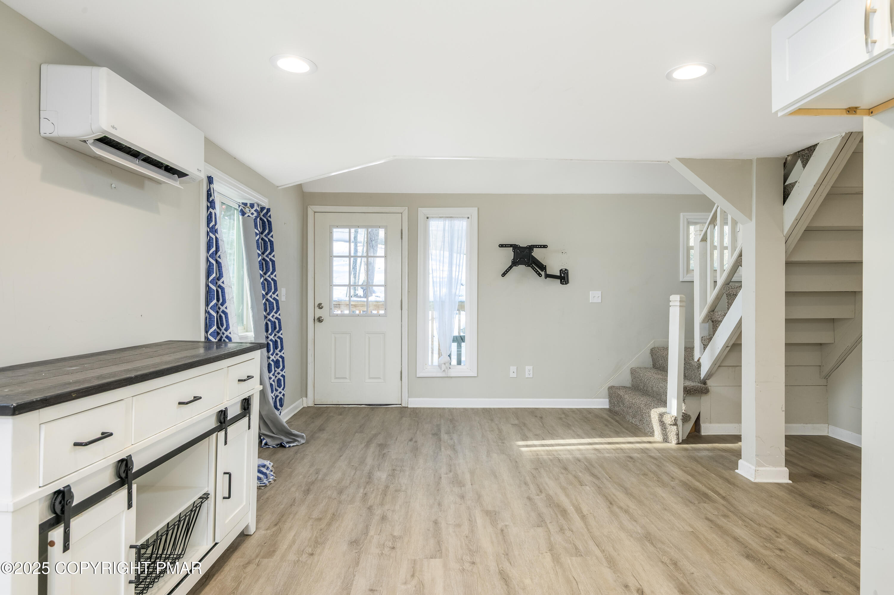 6151 Kansa Road East Stroudsburg, PA 18302 - Photo 14 of 26 a view of an empty room with wooden floor and a window
