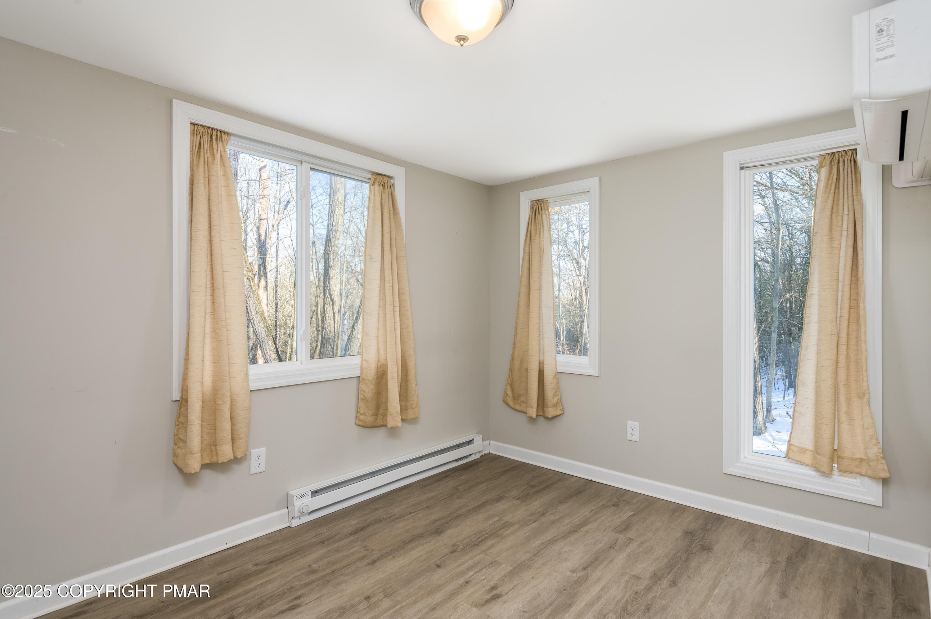 6151 Kansa Road East Stroudsburg, PA 18302 - Photo 16 of 26 a view of an empty room with wooden floor and a window