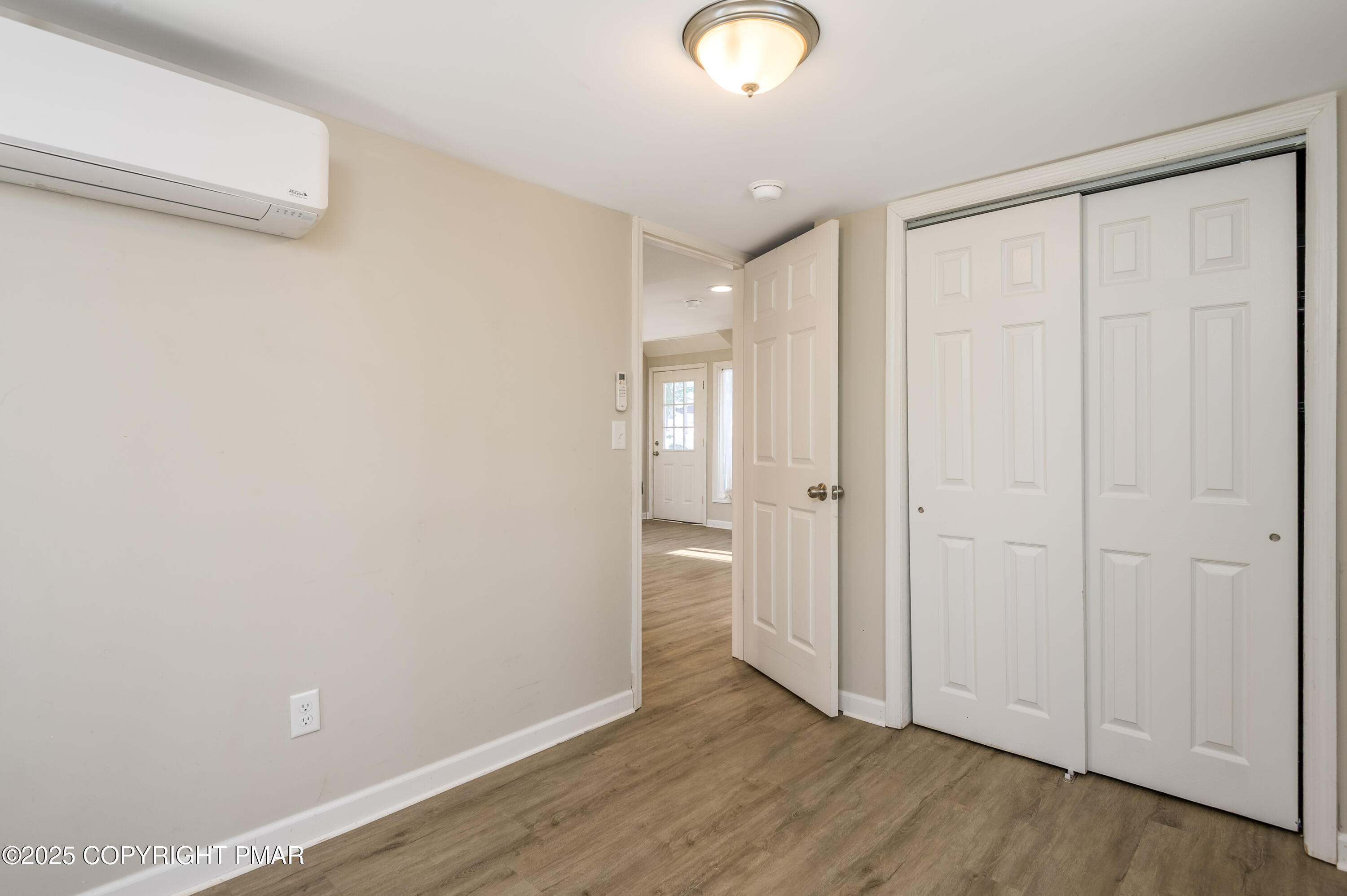 6151 Kansa Road East Stroudsburg, PA 18302 - Photo 17 of 26 a view of an empty room with wooden floor