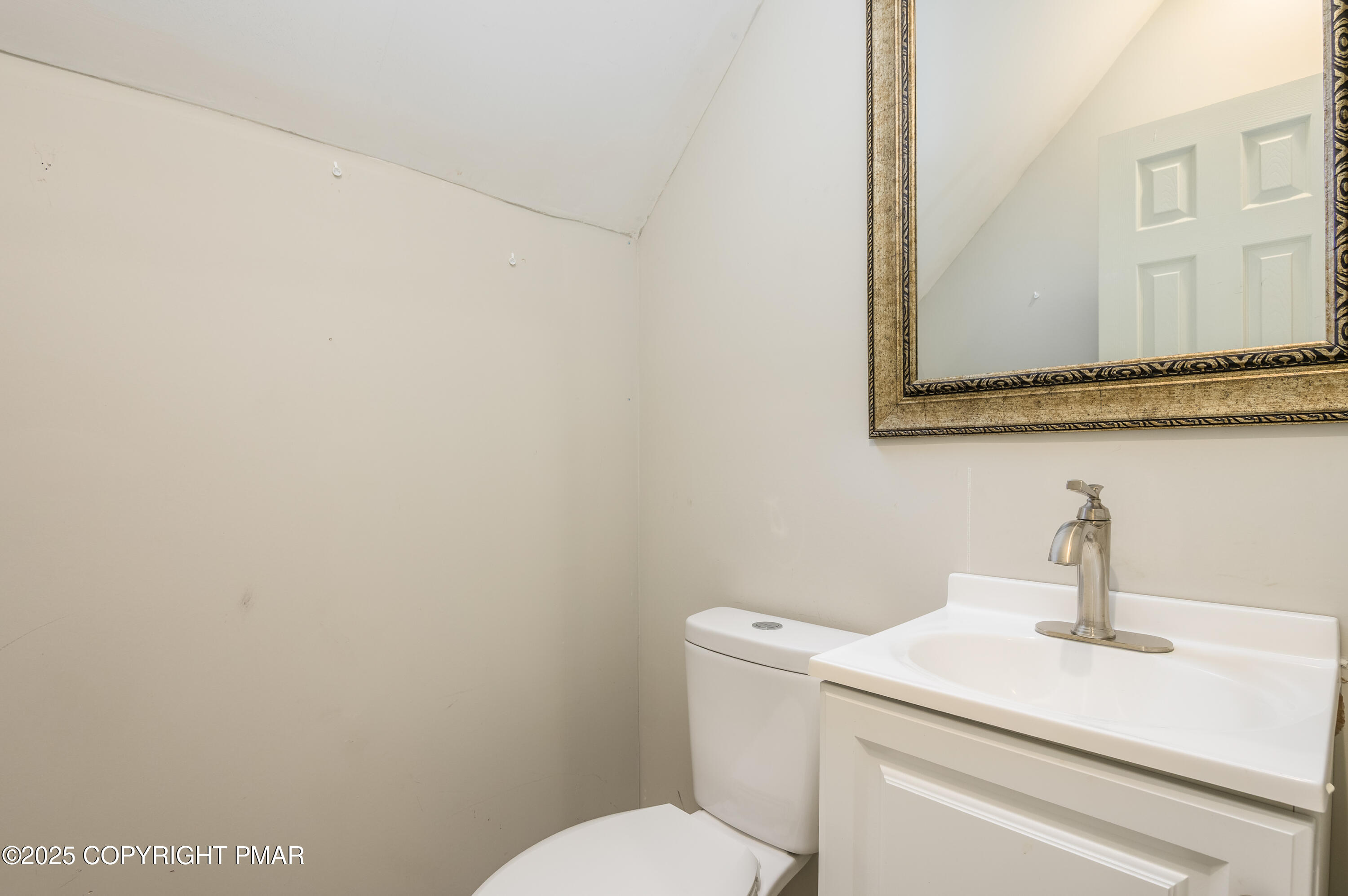 6151 Kansa Road East Stroudsburg, PA 18302 - Photo 21 of 26 a bathroom with a toilet sink and mirror