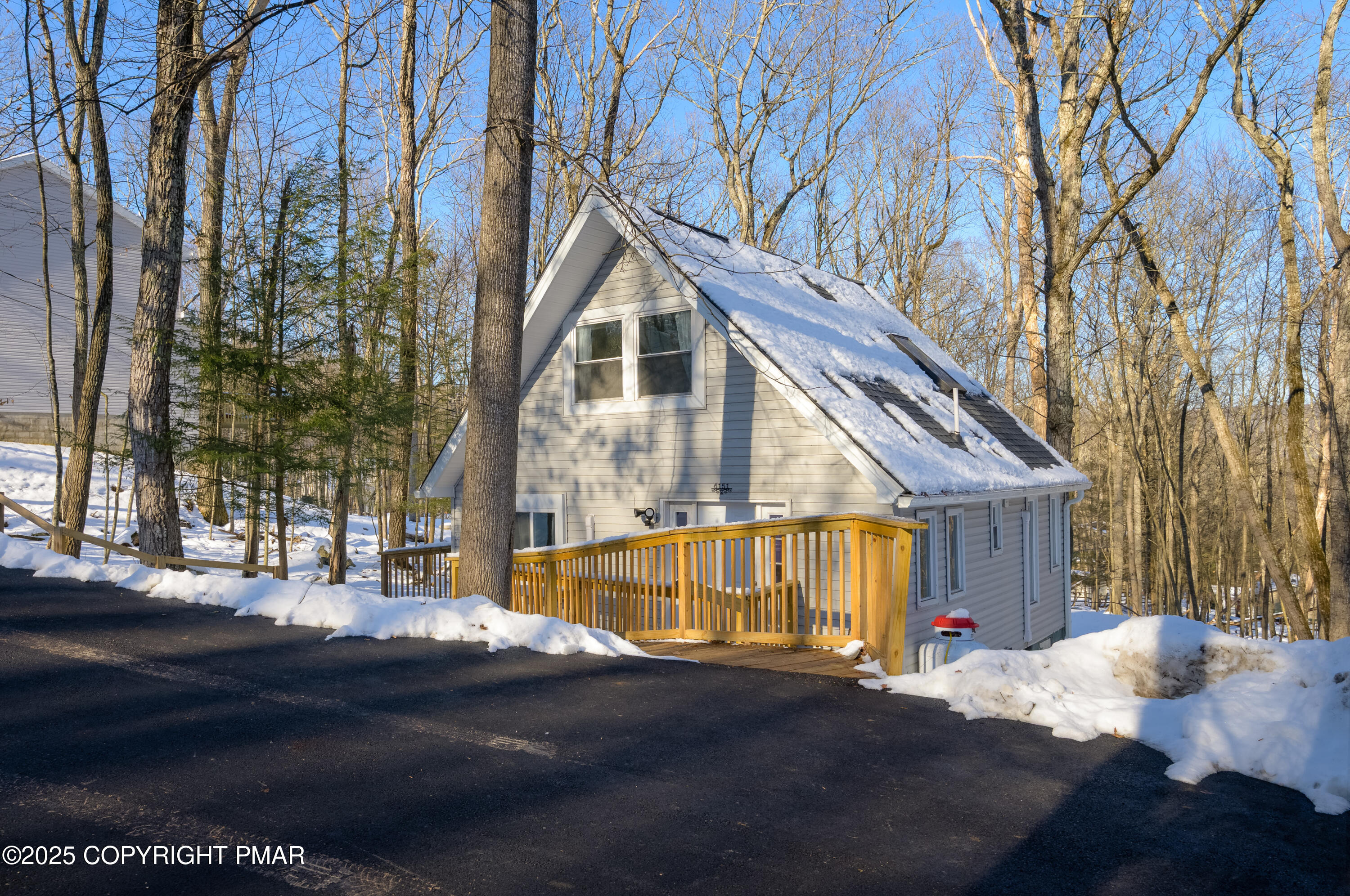 6151 Kansa Road East Stroudsburg, PA 18302 - Photo 3 of 26 a view of a house with snow on the road
