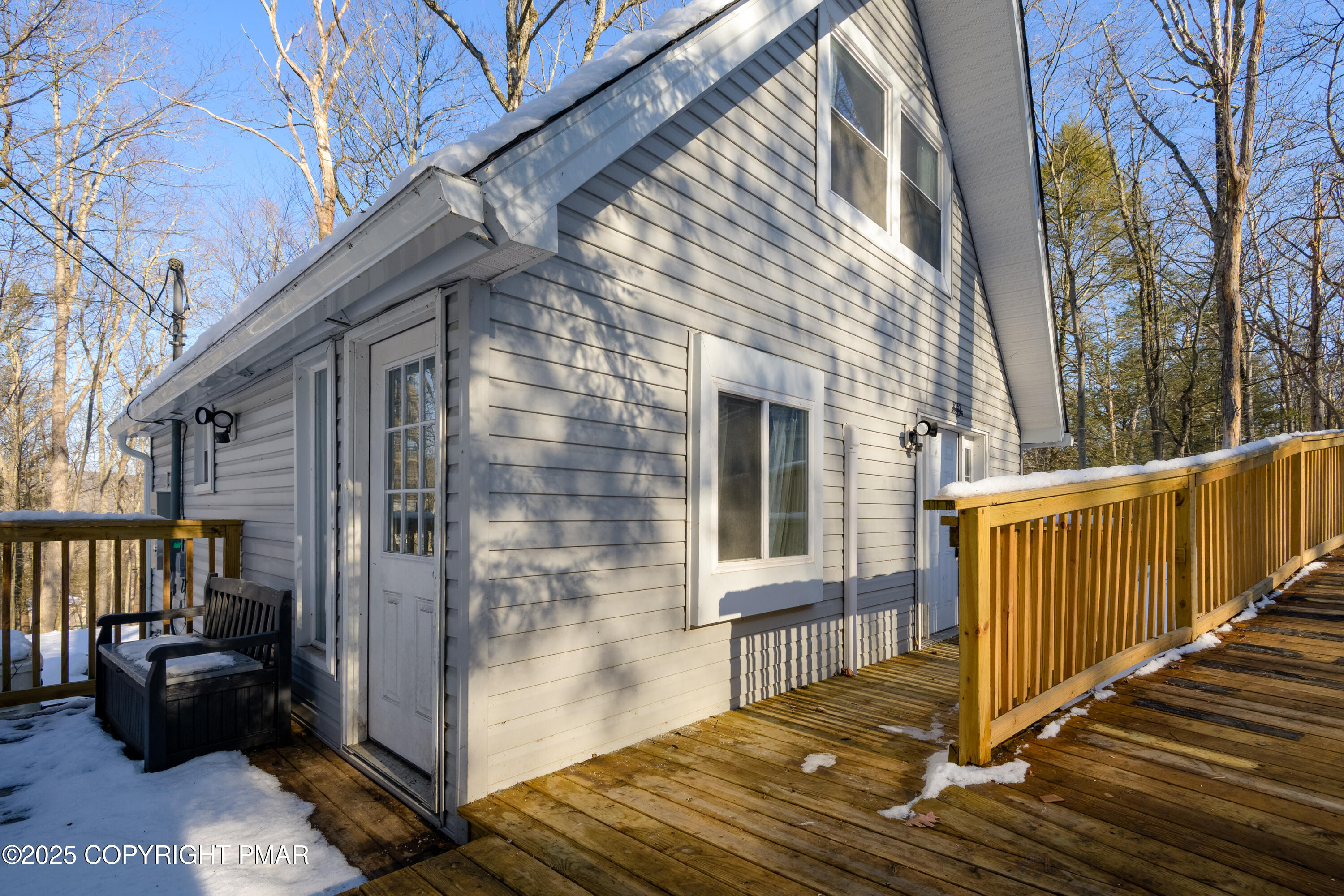 6151 Kansa Road East Stroudsburg, PA 18302 - Photo 4 of 26 a view of a porch with wooden floor and fence