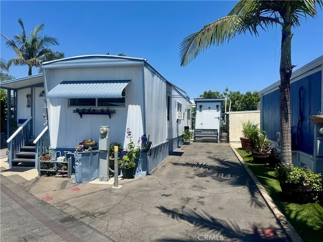 a view of a room with potted plants