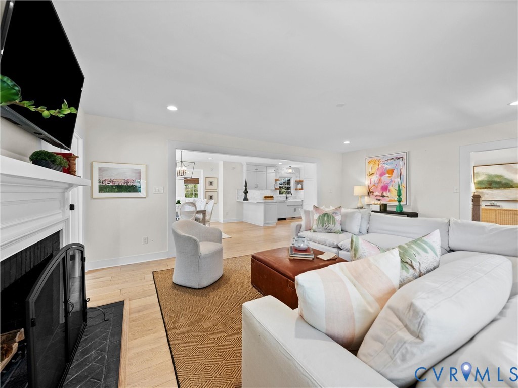 200 North Ridge Road Henrico, VA 23229 - Photo 15 of 85 a living room with furniture a flat screen tv and a fireplace