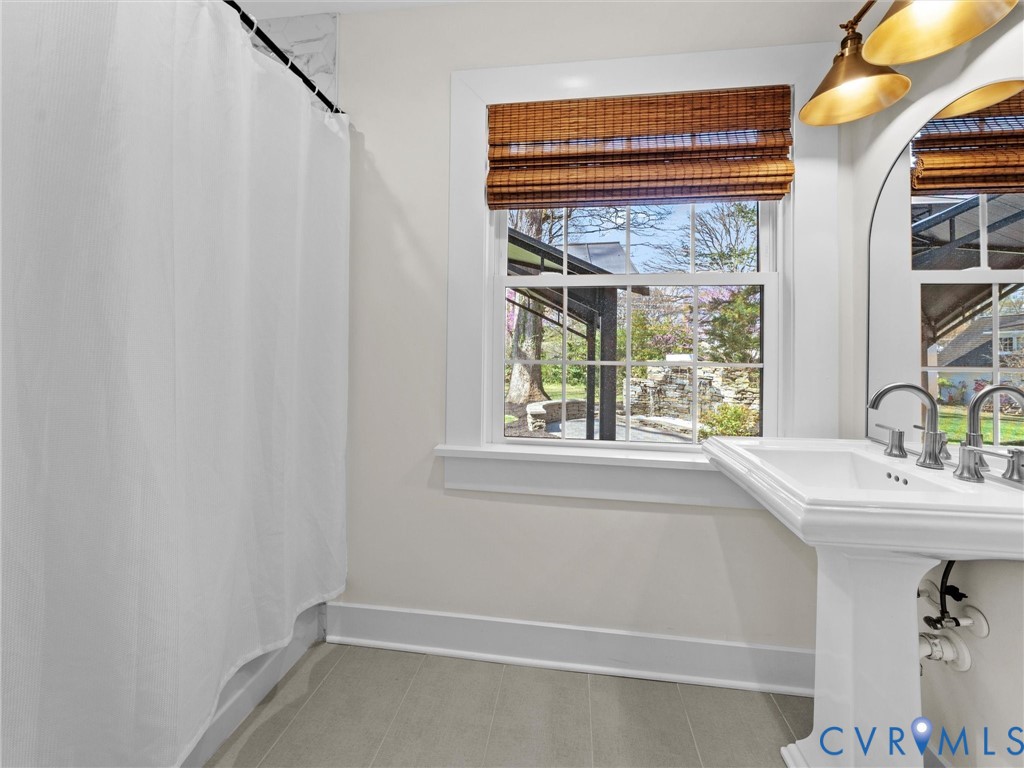 200 North Ridge Road Henrico, VA 23229 - Photo 49 of 85 a bathroom with a sink and a window