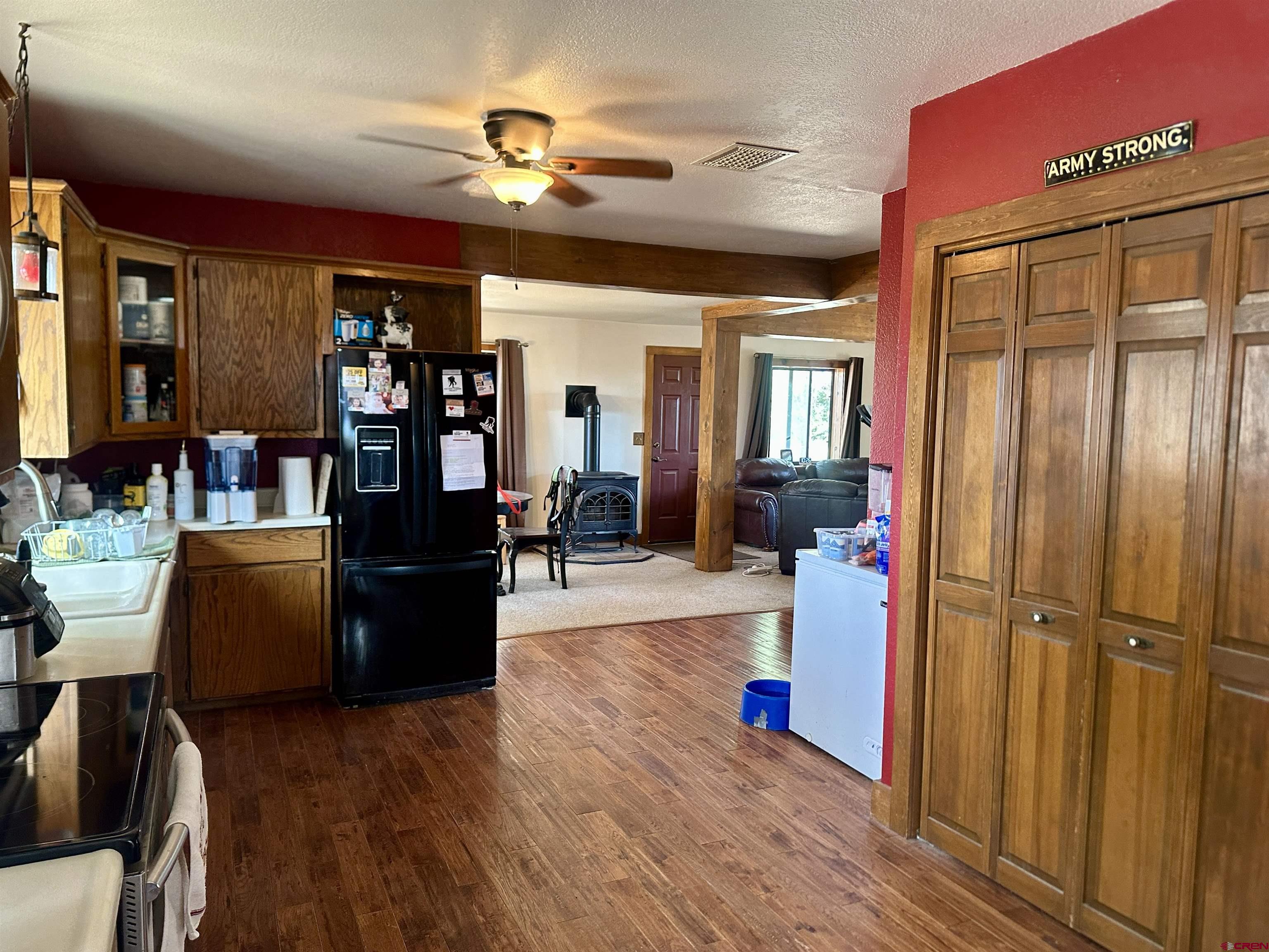 2468 1500th Road Delta, CO 81416 - Photo 11 of 45 a living room with furniture and a flat screen tv