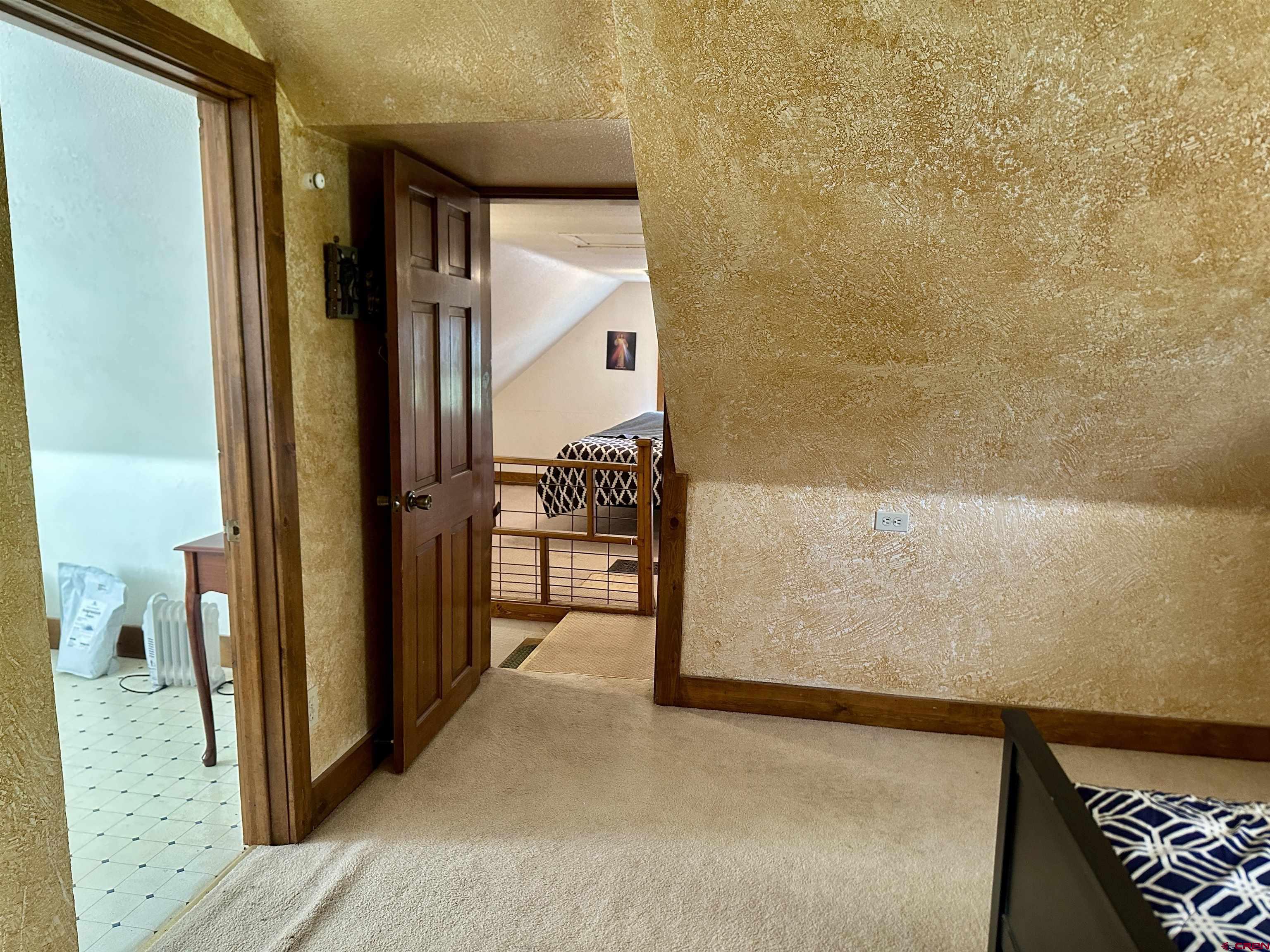 2468 1500th Road Delta, CO 81416 - Photo 19 of 45 a view of hallway with wooden floor and chair
