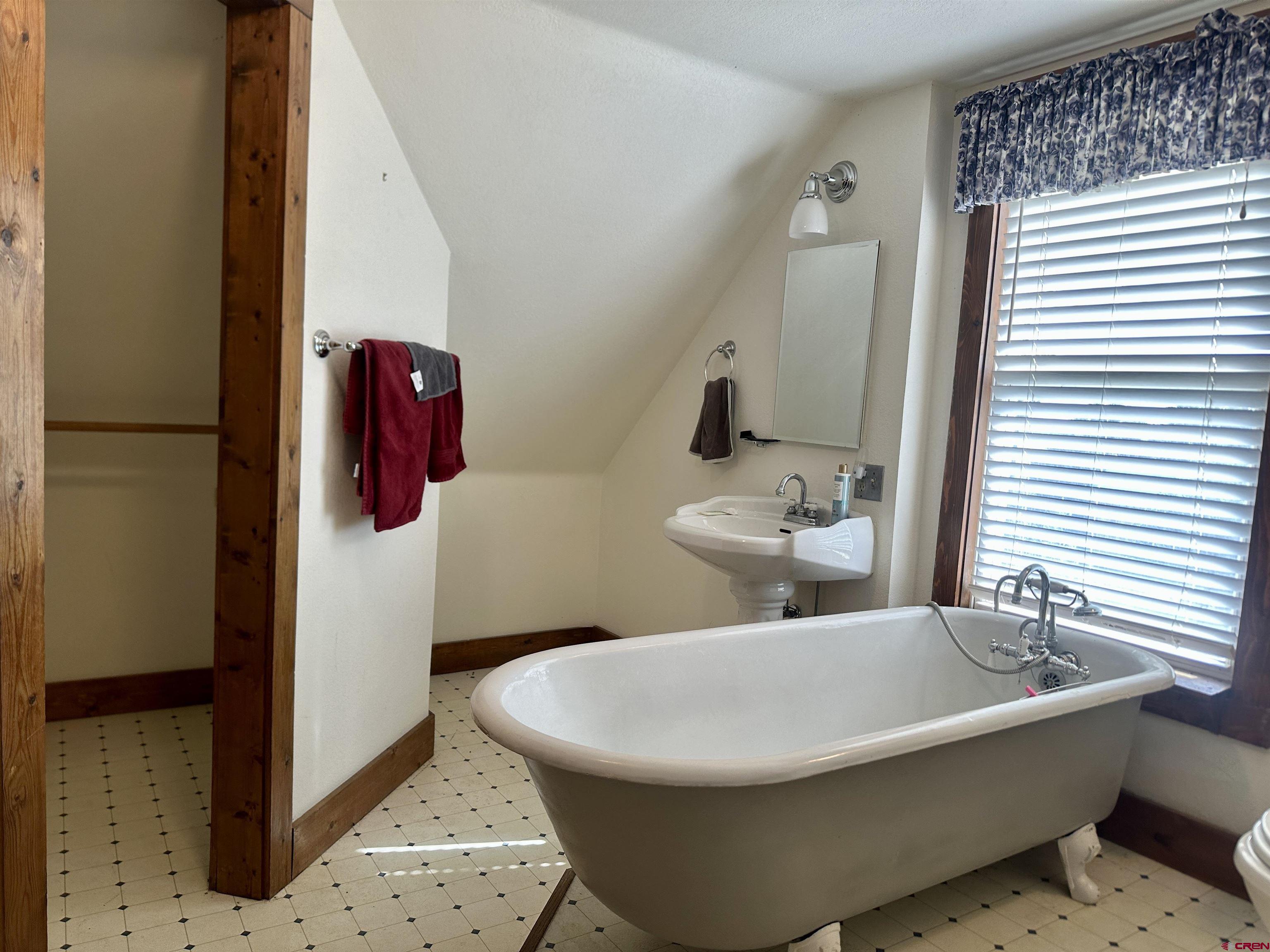 2468 1500th Road Delta, CO 81416 - Photo 21 of 45 a white bath tub sitting next to a white toilet