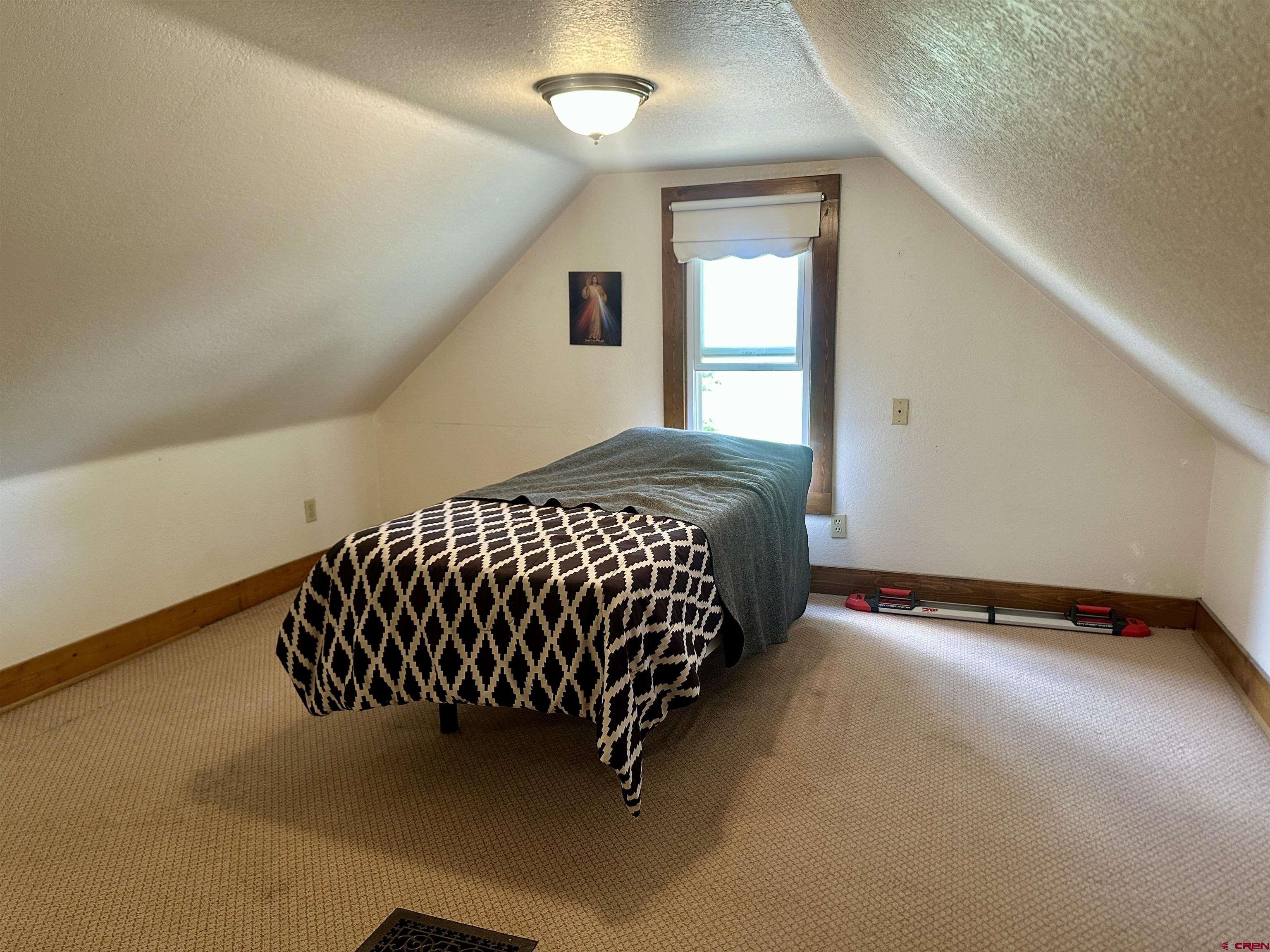 2468 1500th Road Delta, CO 81416 - Photo 23 of 45 a bedroom with a bed and window