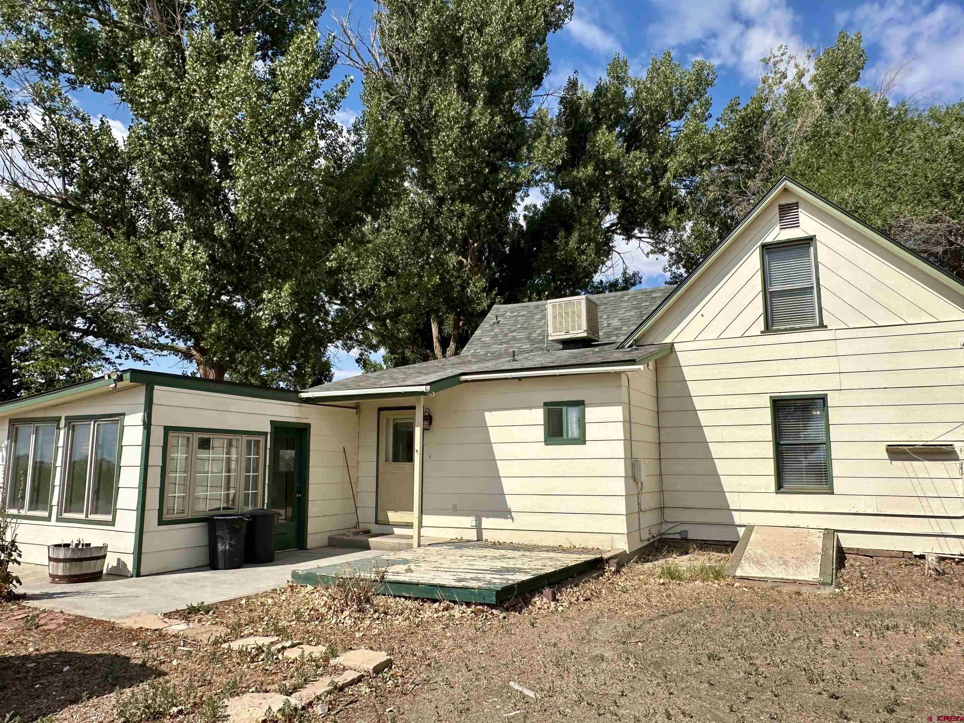 2468 1500th Road Delta, CO 81416 - Photo 24 of 45 a front view of a house with a yard