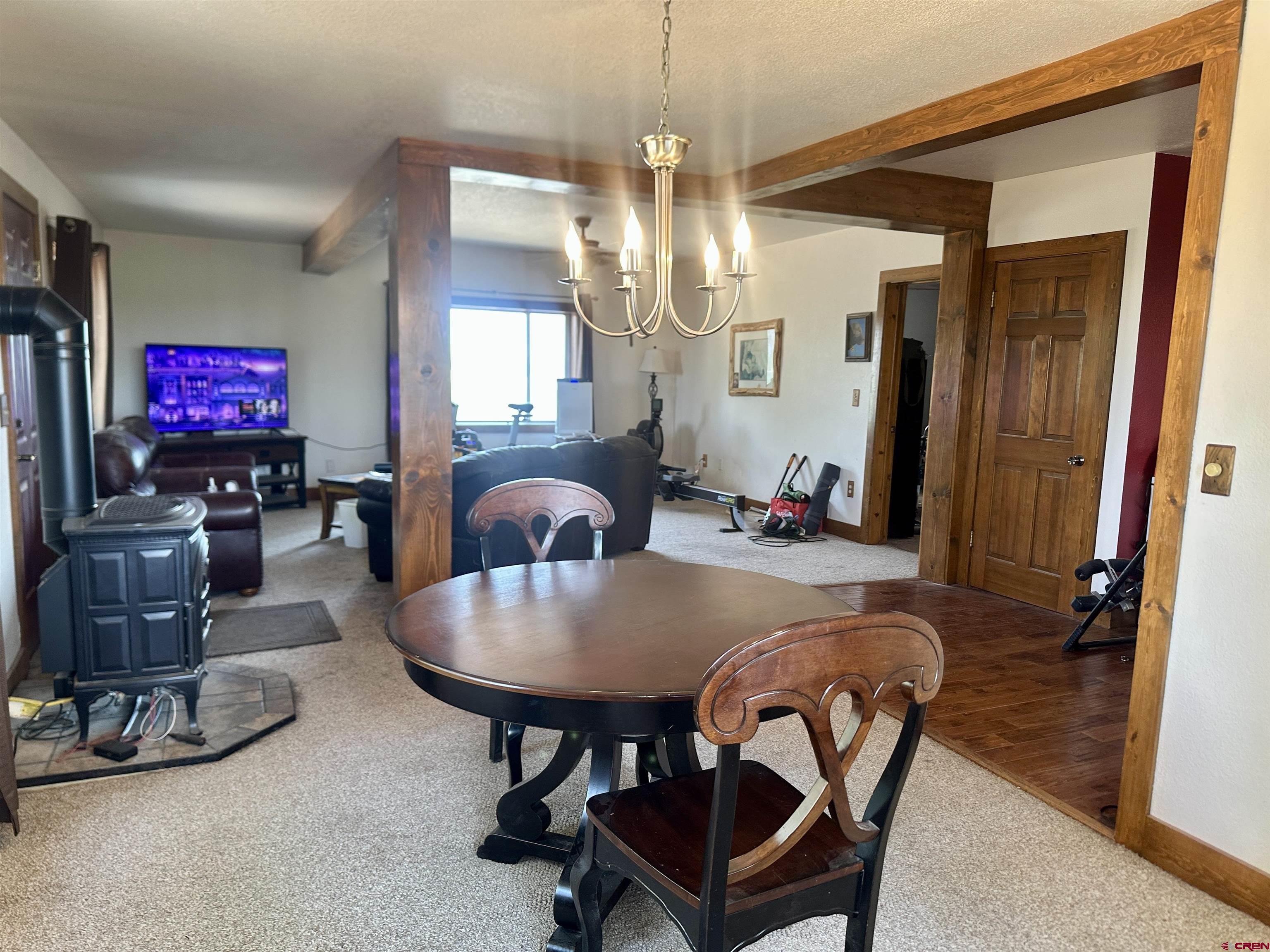 2468 1500th Road Delta, CO 81416 - Photo 6 of 45 a living room with furniture a flat screen tv and kitchen view