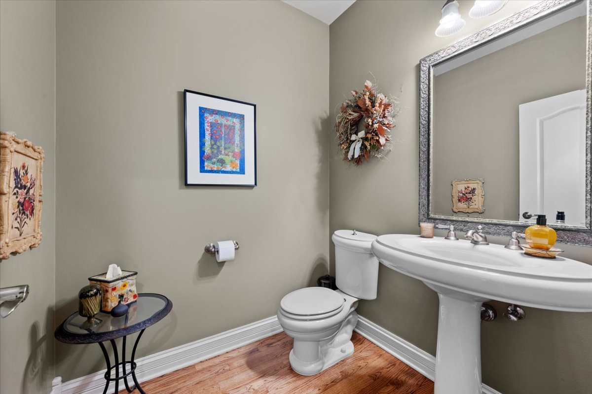 9-n050 Dittman Road Elgin, IL 60124 - Photo 51 of 54 a bathroom with a toilet a sink and mirror