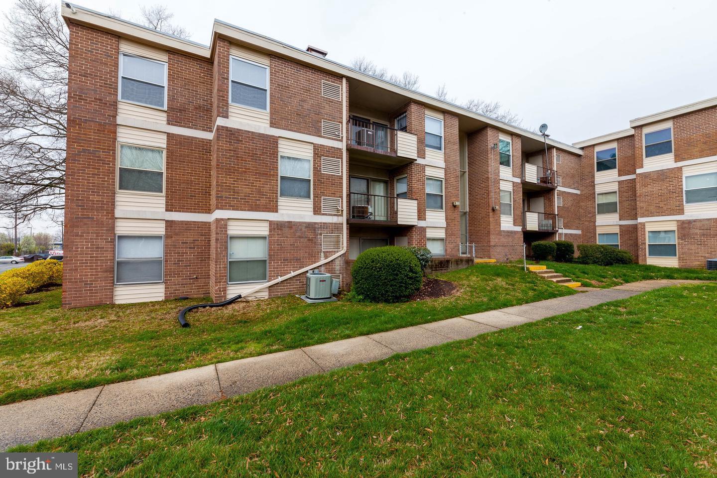 3827 St Barnabas Road, Unit T Suitland, MD 20746 - Photo 2 of 15 Charming brick apartment complex exterior.
