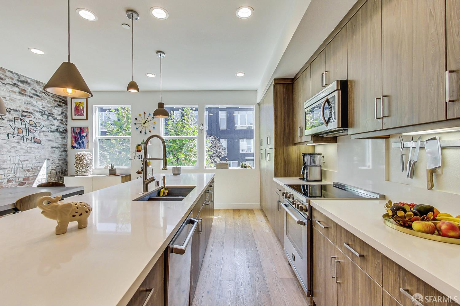 1353 Pullman Way Oakland, CA 94607 - Photo 29 of 55 a kitchen with a sink a stove and cabinets