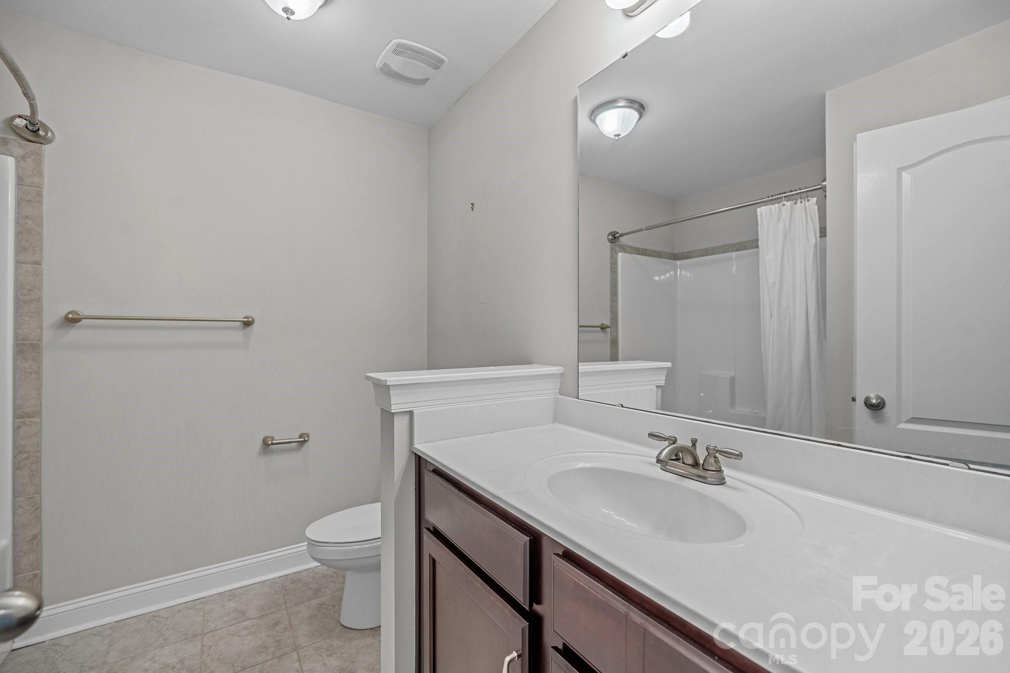 4697 Rinaldo Road York, SC 29745 - Photo 25 of 37 a bathroom with a sink toilet vanity and tub