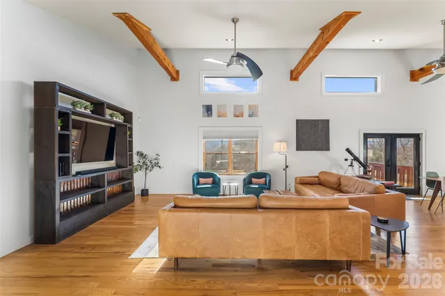 a living room with fireplace furniture and a flat screen tv