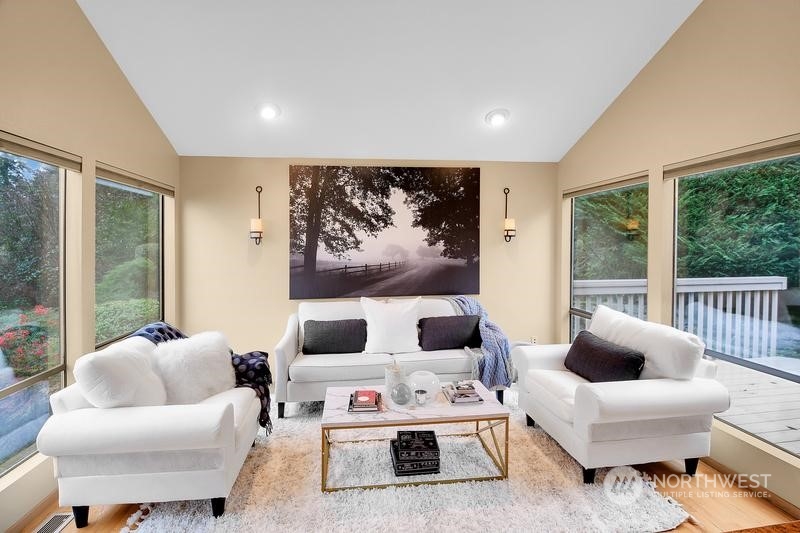 8045 West Mercer Way Mercer Island, WA 98040 - Photo 22 of 38 a living room with furniture and a large window