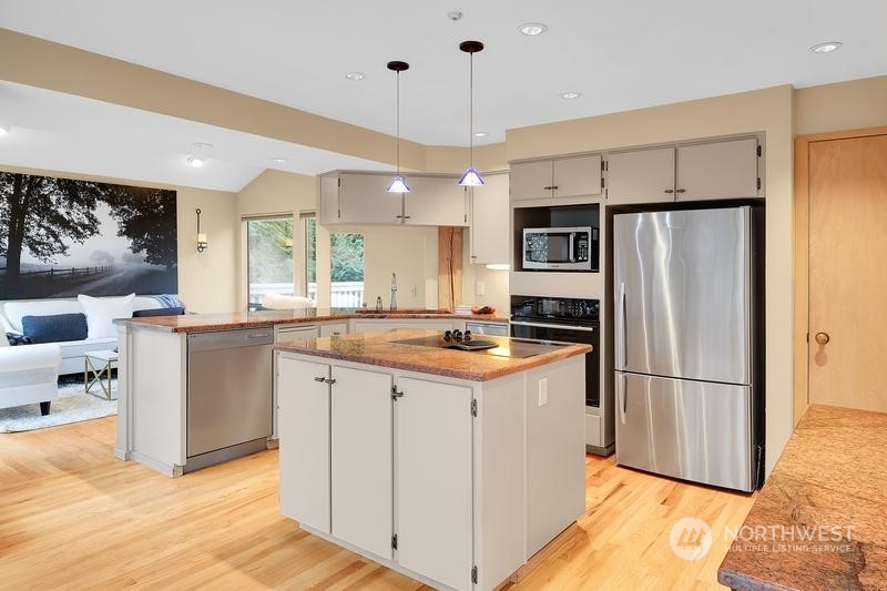 8045 West Mercer Way Mercer Island, WA 98040 - Photo 23 of 38 a kitchen with stainless steel appliances granite countertop a refrigerator a sink and a stove
