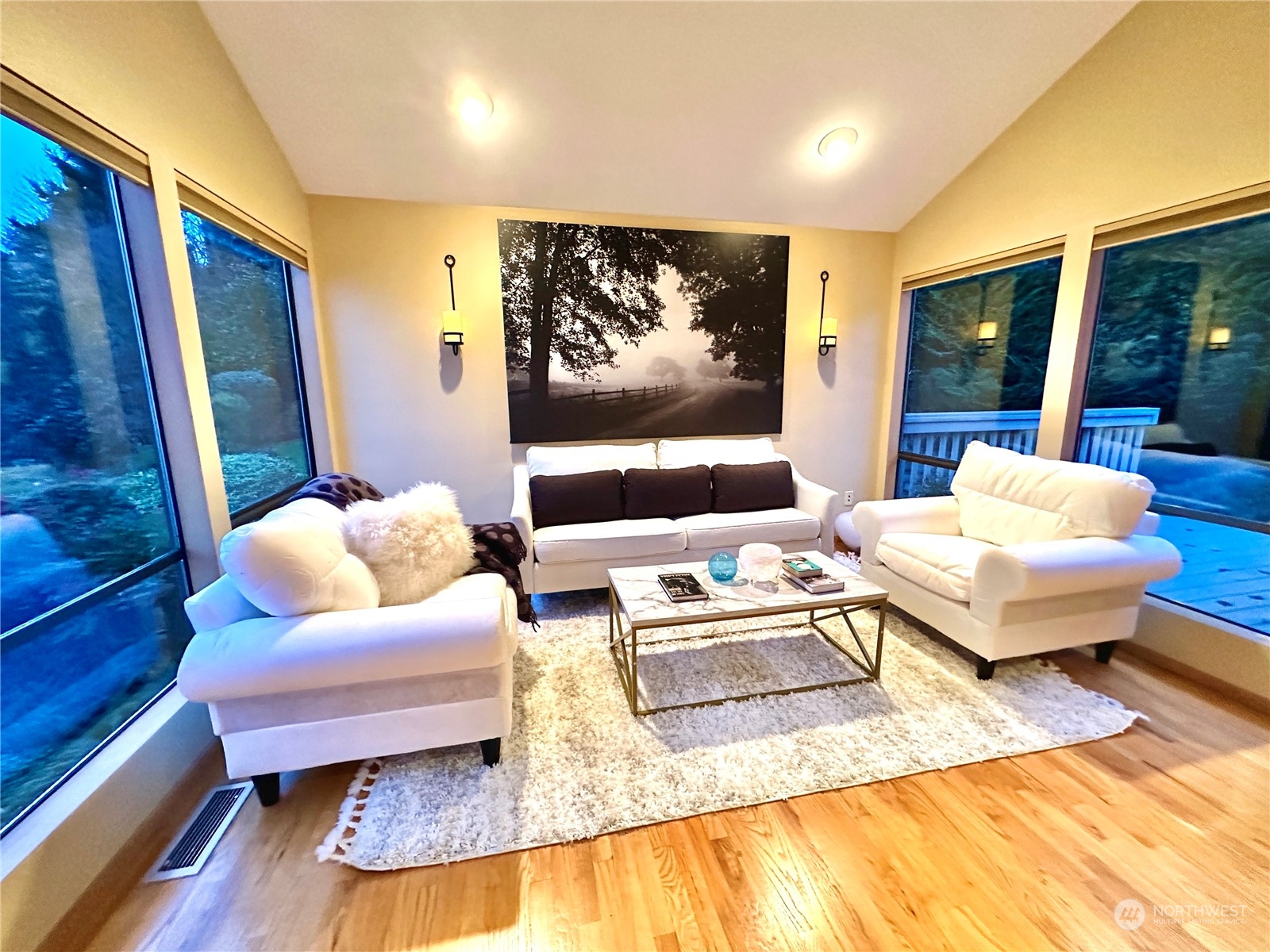 8045 West Mercer Way Mercer Island, WA 98040 - Photo 28 of 38 a living room with furniture and a flat screen tv