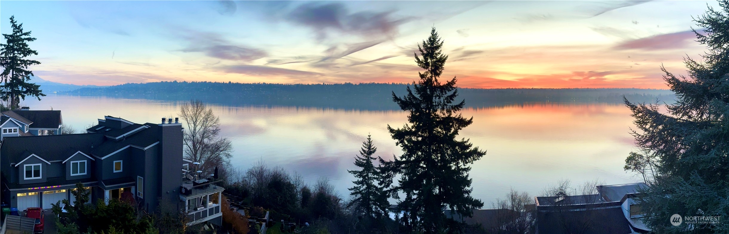 8045 West Mercer Way Mercer Island, WA 98040 - Photo 38 of 38 a sunset view with a lake