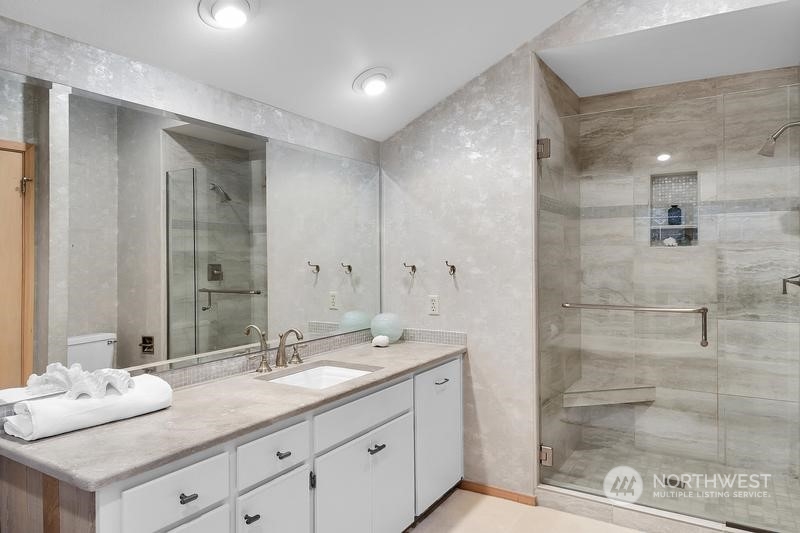 8045 West Mercer Way Mercer Island, WA 98040 - Photo 9 of 38 a bathroom with a granite countertop sink mirror and double