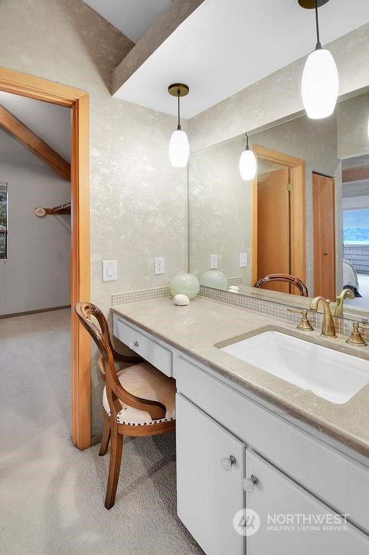 8045 West Mercer Way Mercer Island, WA 98040 - Photo 10 of 38 a bathroom with a sink and a mirror