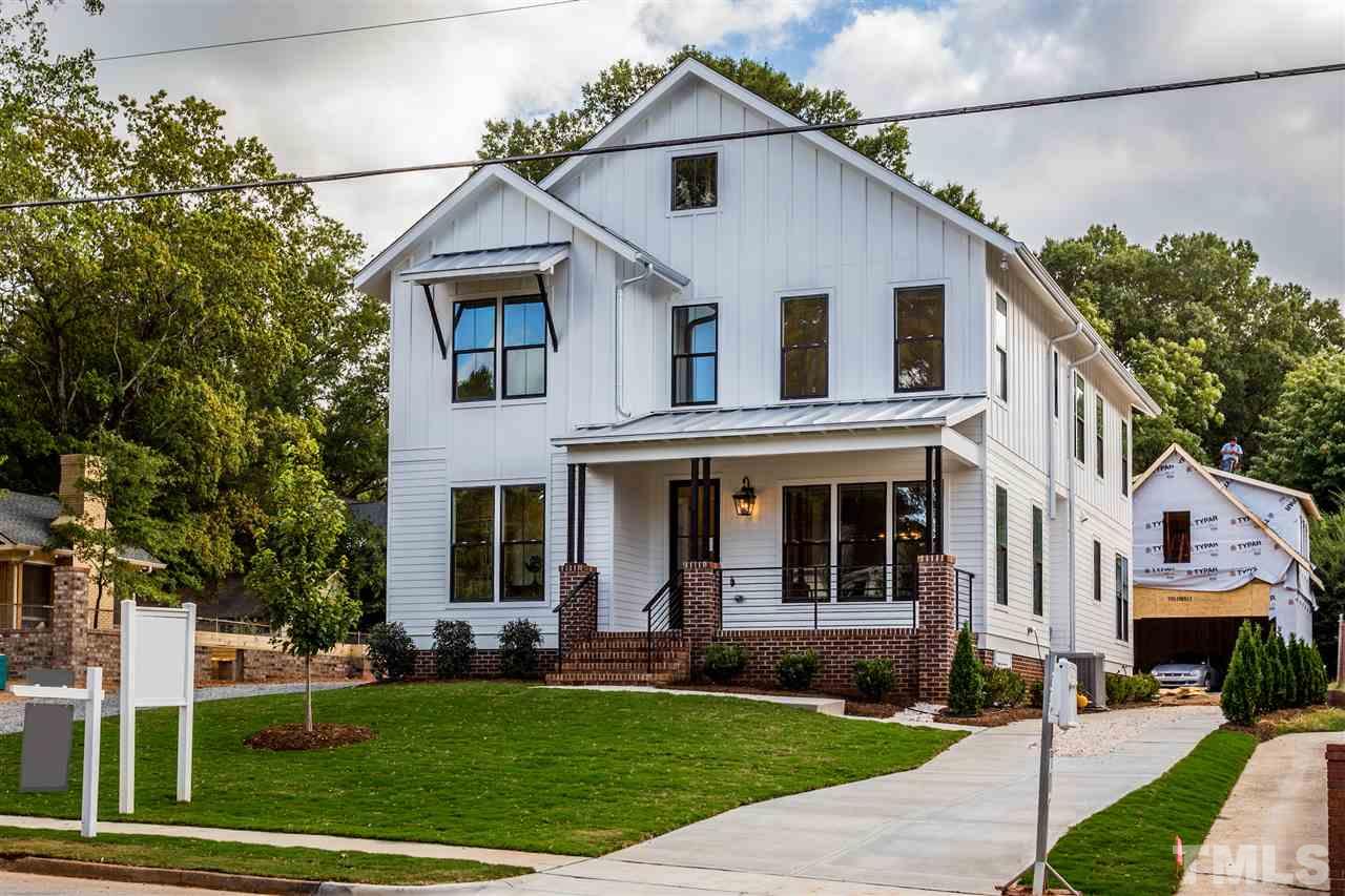 3203.5 Clark Avenue Raleigh, NC 27607 - Photo 2 of 25 a view of a white house with a big yard and potted plants
