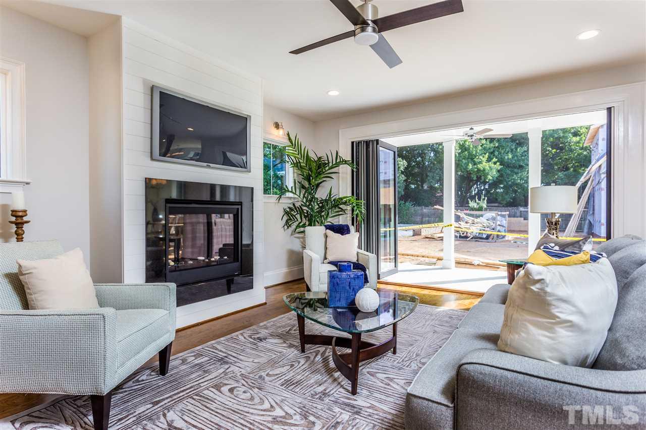 3203.5 Clark Avenue Raleigh, NC 27607 - Photo 13 of 25 a living room with furniture and a fireplace