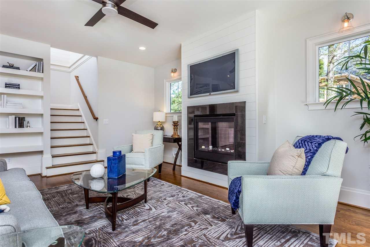 3203.5 Clark Avenue Raleigh, NC 27607 - Photo 16 of 25 a living room with furniture and a fireplace