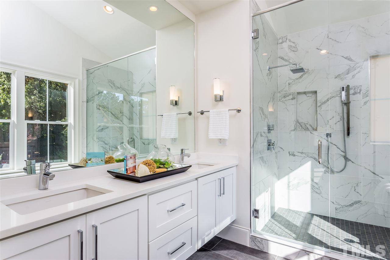 3203.5 Clark Avenue Raleigh, NC 27607 - Photo 20 of 25 a bathroom with a sink double vanity and a shower