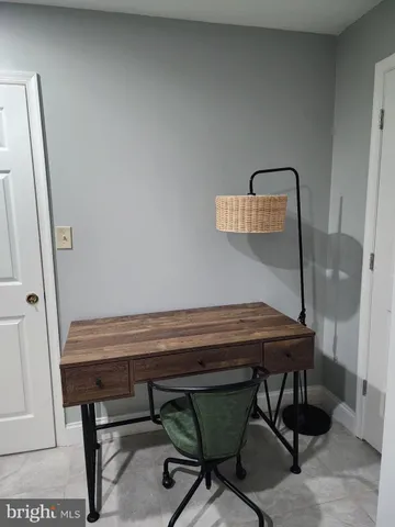 a room with a table and chairs