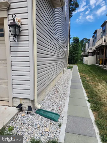 a view of a pathway both side of house