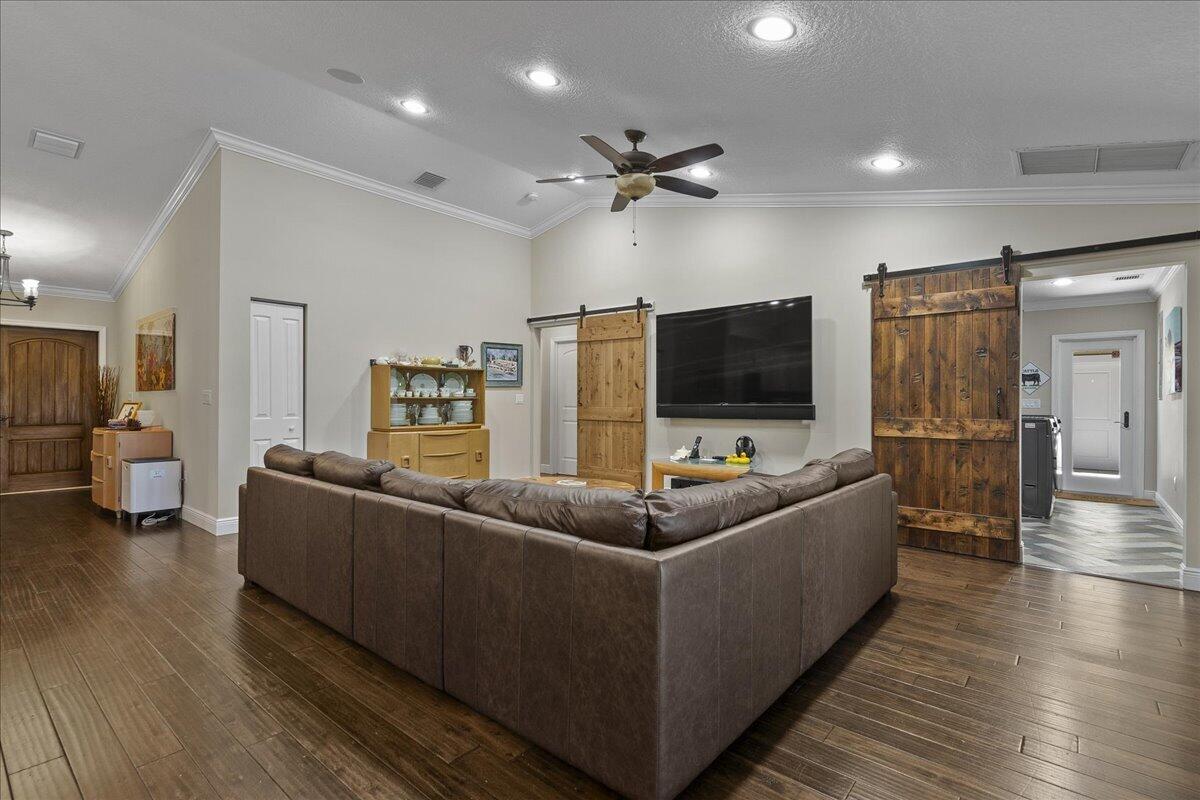 10975 Randolph Siding Road Jupiter, FL 33478 - Photo 19 of 97 a living room with furniture and a flat screen tv