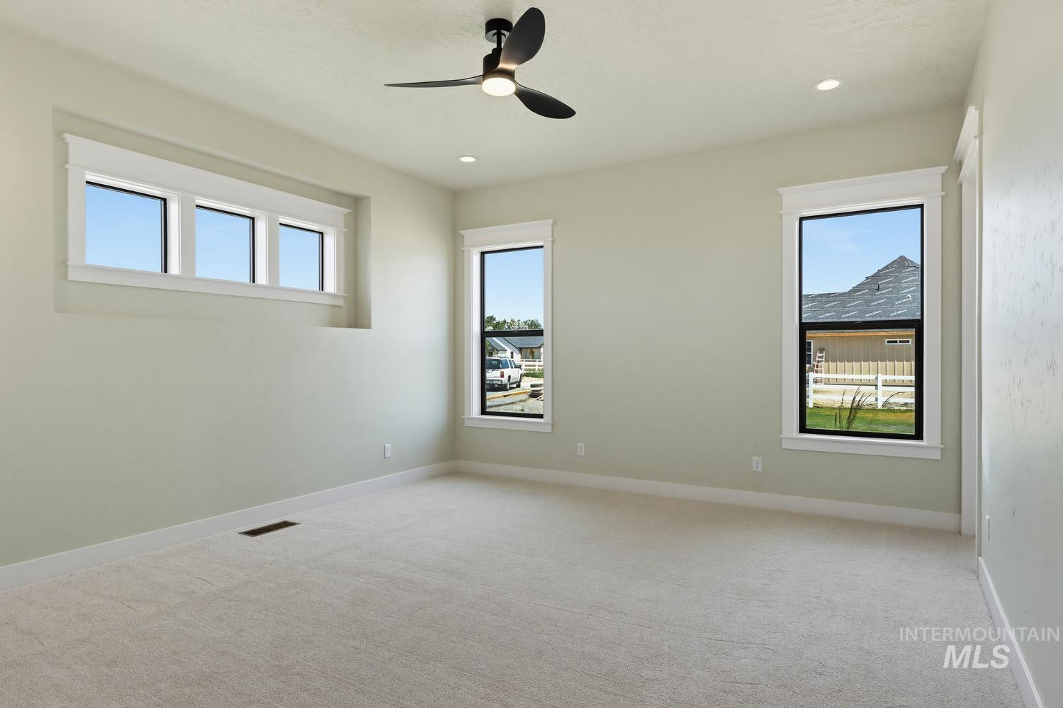 5054 Heritage Drive Marsing, ID 83639 - Photo 34 of 38 Spacious room featuring light-colored carpet flooring, recessed lighting, and a contemporary ceiling fan