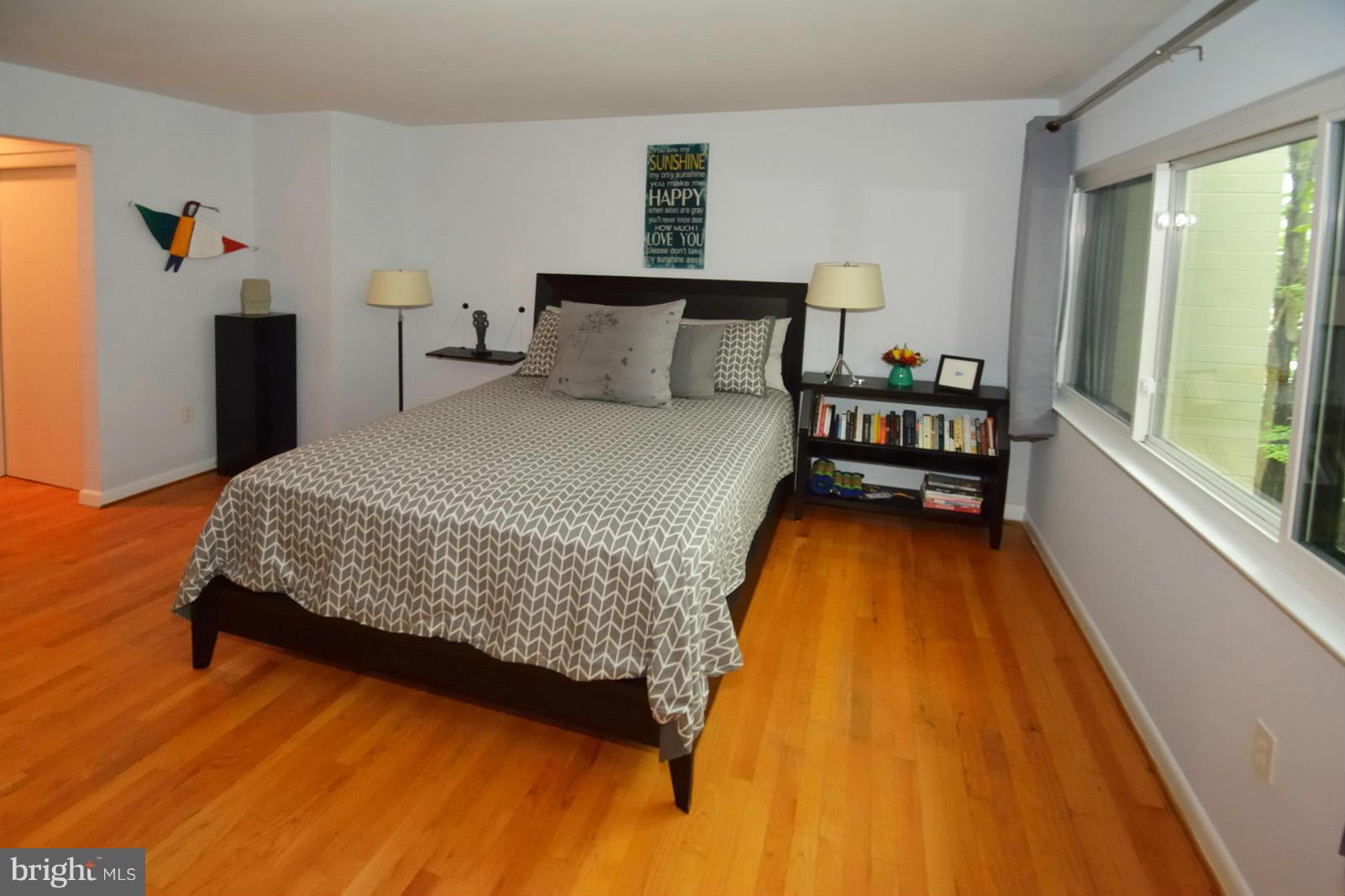 1608 Waters Edge Lane Reston, VA 20190 - Photo 14 of 27 a bedroom with a bed and wooden floor