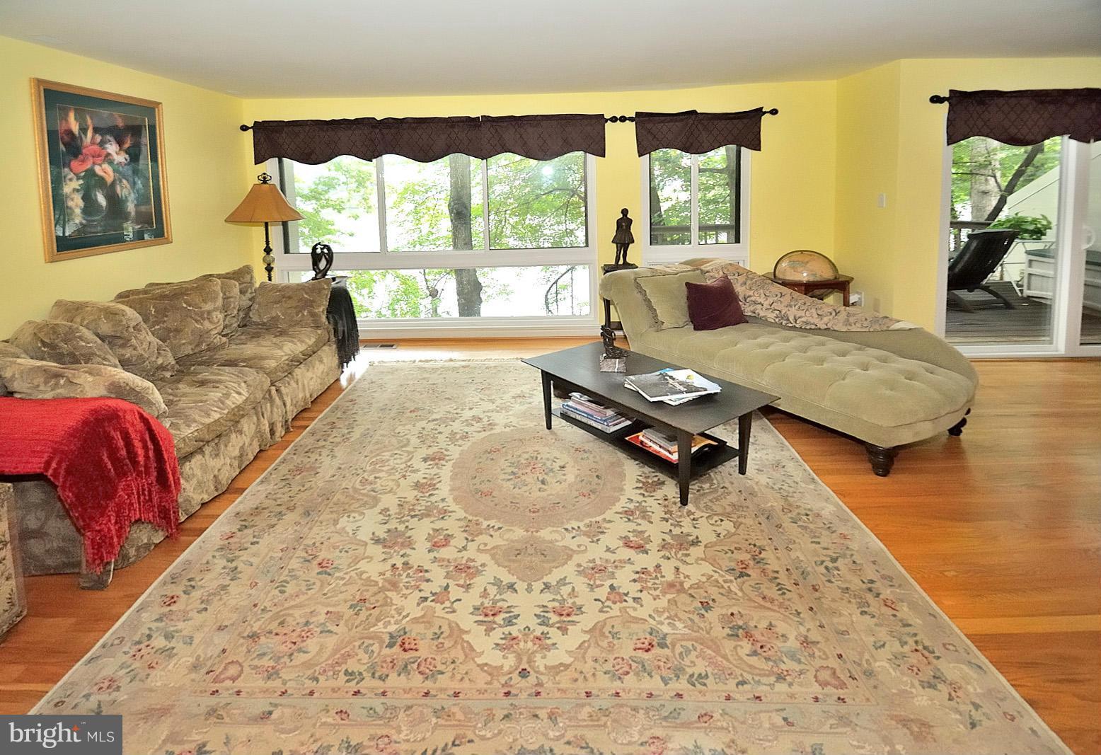 1608 Waters Edge Lane Reston, VA 20190 - Photo 3 of 27 a living room with furniture and a large window
