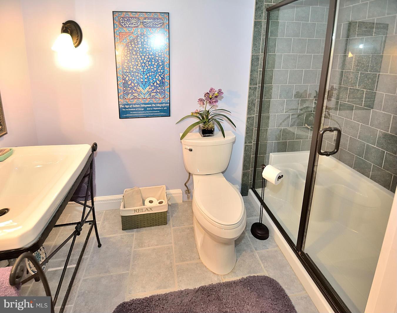 1608 Waters Edge Lane Reston, VA 20190 - Photo 21 of 27 a bathroom with a sink a toilet and a mirror