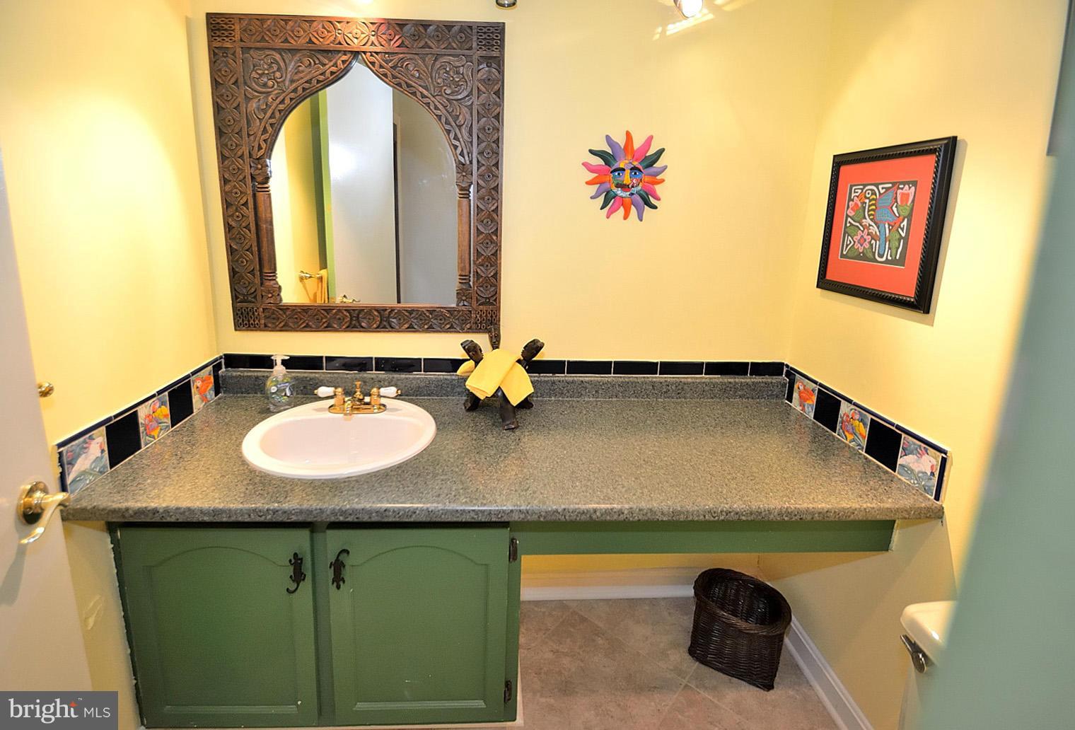 1608 Waters Edge Lane Reston, VA 20190 - Photo 22 of 27 a bathroom with a sink and a mirror