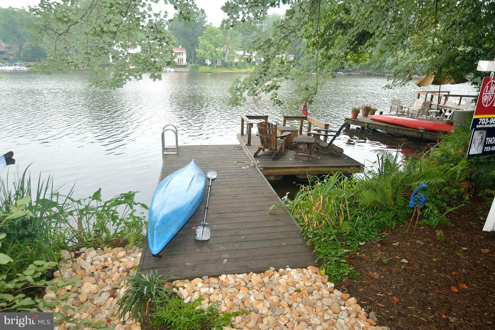 1608 Waters Edge Lane Reston, VA 20190 - Photo 27 of 27 a view of a lake with sitting area