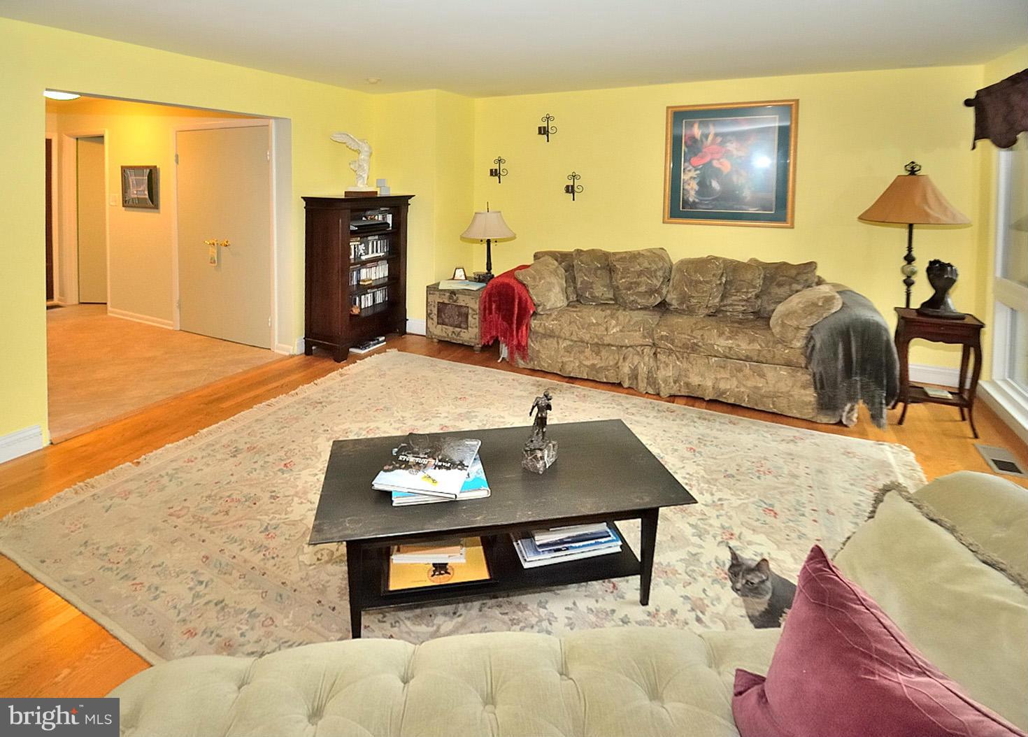1608 Waters Edge Lane Reston, VA 20190 - Photo 4 of 27 a living room with furniture and a flat screen tv