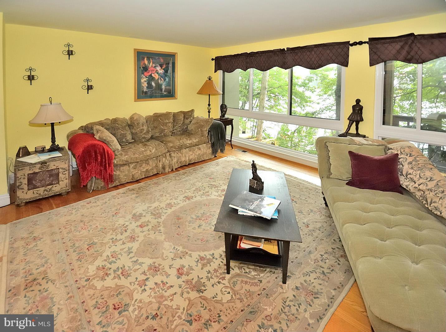 1608 Waters Edge Lane Reston, VA 20190 - Photo 5 of 27 a living room with furniture and a large window