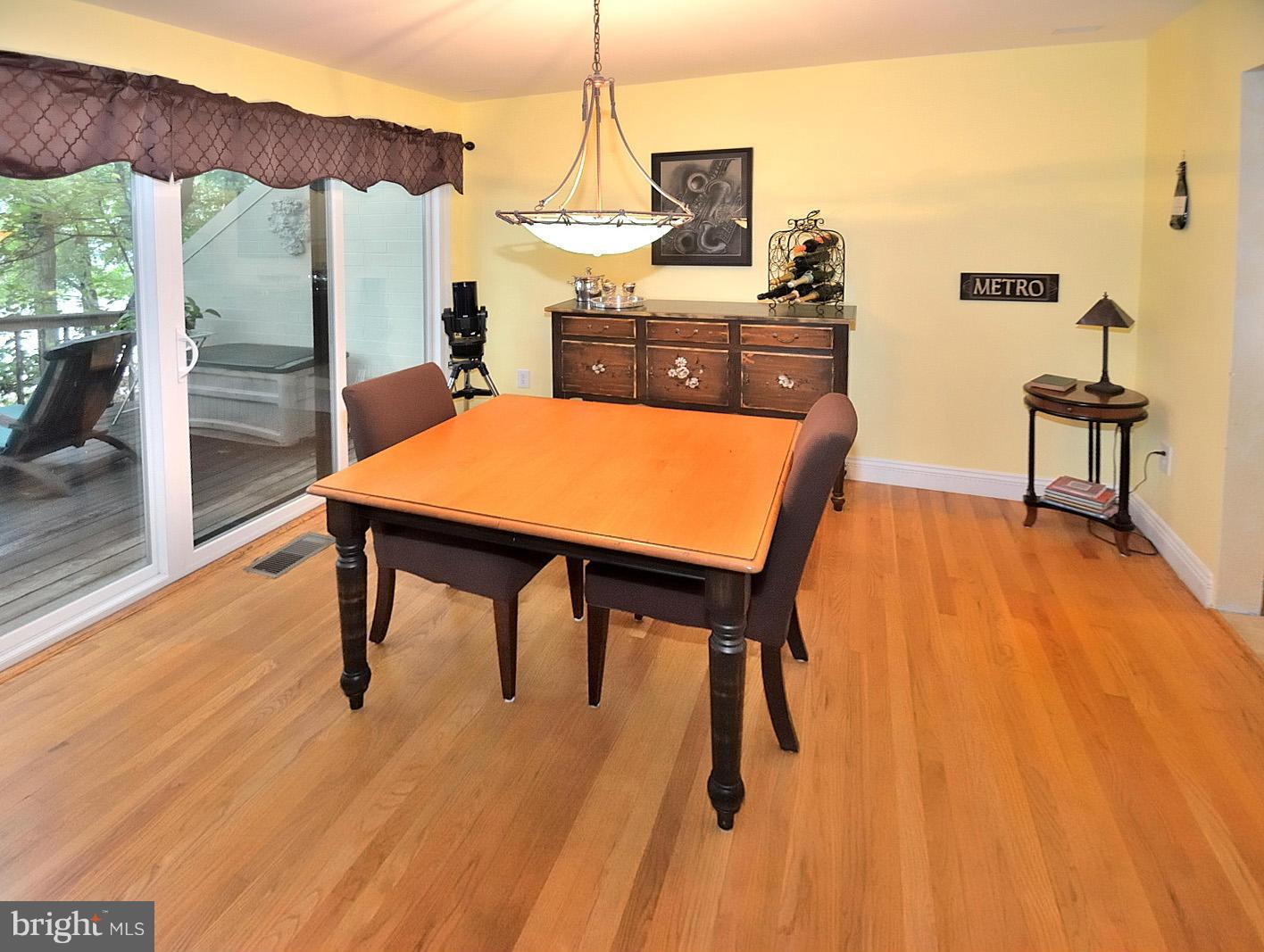 1608 Waters Edge Lane Reston, VA 20190 - Photo 9 of 27 a view of a dining room with furniture and wooden floor