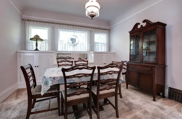 a view of wooden floor and windows in a room