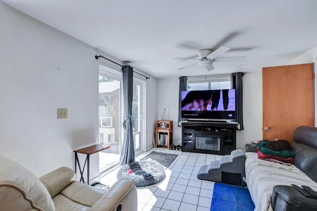 a white toilet sitting next to a shower curtain