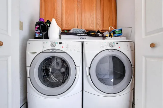 a view of empty room with ceiling fan and window