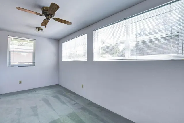a view of a house with backyard porch and sitting area