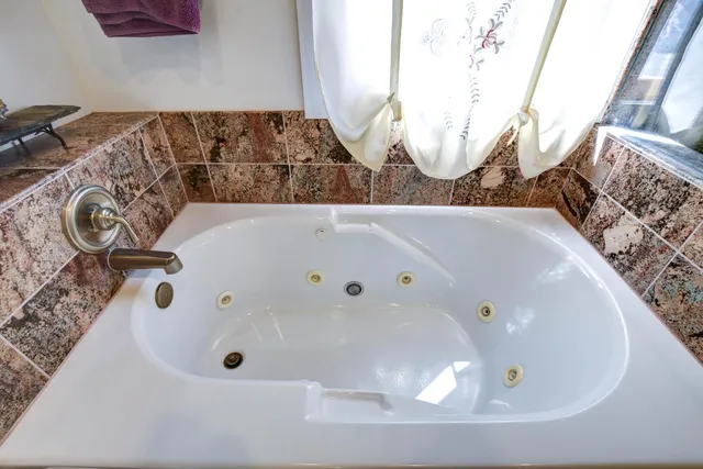 a view of a porch with furniture and a patio