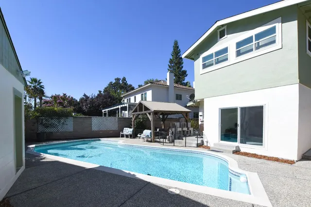 a view of a chairs and table in the patio